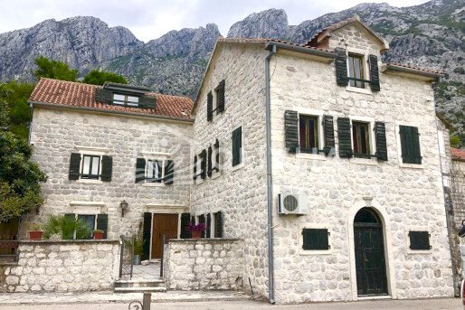 Stone three-story house on the first line in Orahovac, on the coast of the Bay of Kotor